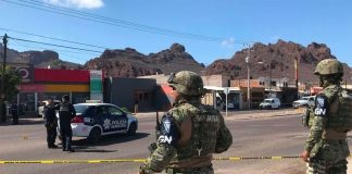 National Guardsmen watch over Guaymas crime scene on Tuesday.