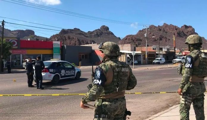 National Guardsmen watch over Guaymas crime scene on Tuesday.