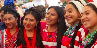 Actress Yalitza Aparicio, center, with Guelaguetza dancers in Oaxaca.