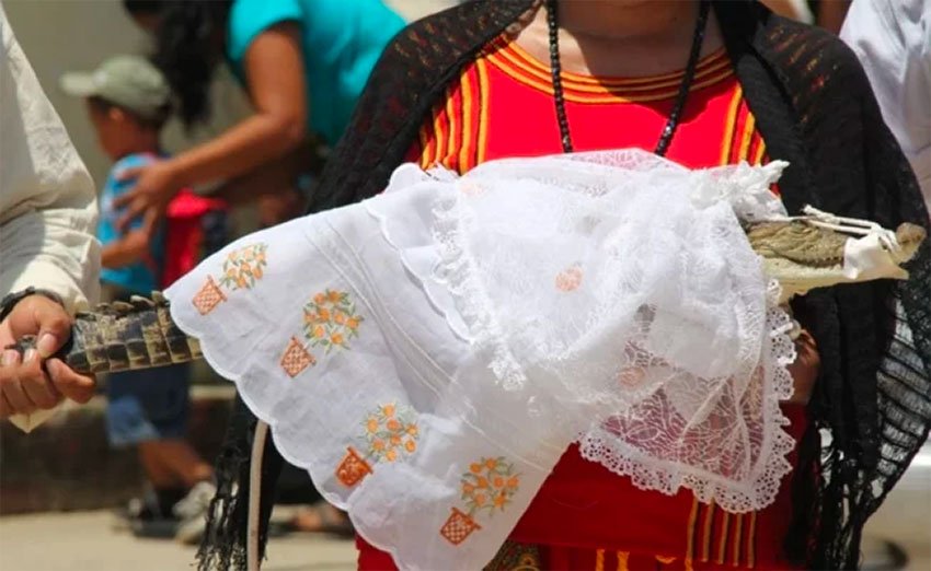 The bride in her wedding dress — and snout tied shut.