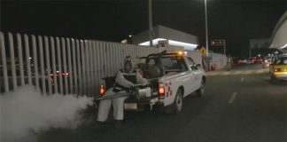 Spraying against mosquitoes at Guadalajara airport.