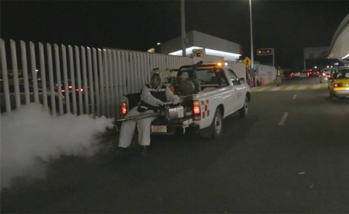 Spraying against mosquitoes at Guadalajara airport.