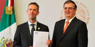 OPIC's Ryan Brennan, left, and Foreign Secretary Ebrard.