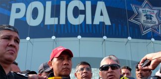 Protesting police address reporters.