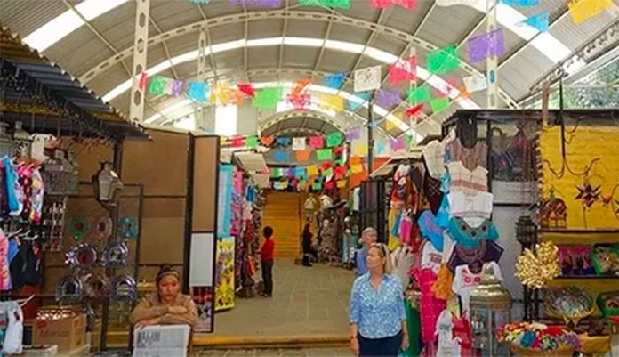 Vendors at the artisans' market are among those forced to pay extortion.