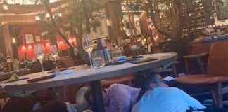 Restaurant patrons take cover in yesterday's shooting.