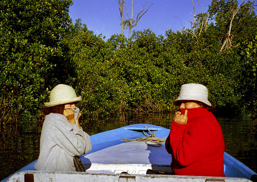 On a panga at San Blás. Are they cold or fighting off gnats?