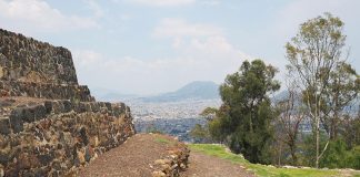 Temple and volcano view atop Cerro de la Estrella National Park.