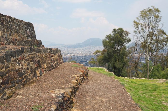 Temple and volcano view atop Cerro de la Estrella National Park.