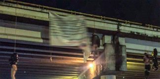 Bodies hang from an overpass this morning with a narco-banner signed by the Jalisco New Generation Cartel.
