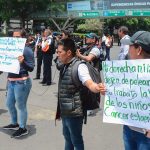 Protesting parents block traffic on Monday at Mexico City airport.
