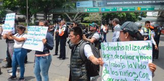 Protesting parents block traffic on Monday at Mexico City airport.