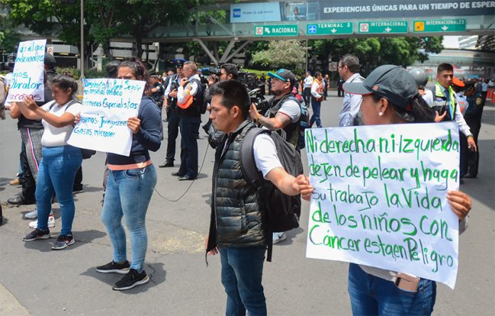 Protesting parents block traffic on Monday at Mexico City airport.