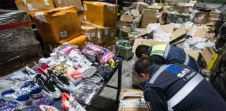 Customs agents inspect a big seizure of pirated goods in April.