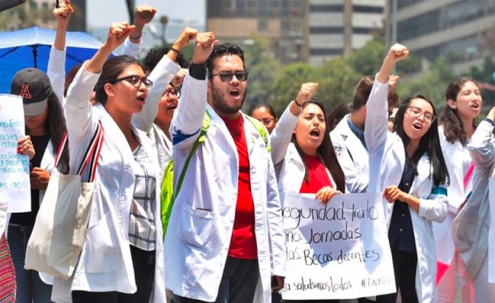 Interns march in Mexico City today.