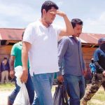 Flanked by masked socialist front members, police are set free.