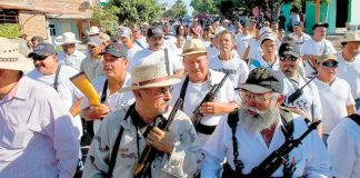 A file photo of one of Michoacán's first defense forces. In front at left is founder José Manuel Mireles.