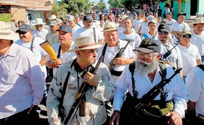 A file photo of one of Michoacán's first defense forces. In front at left is founder José Manuel Mireles.