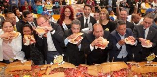 Officials chow down at the opening of Mexico City's Torta Fair.