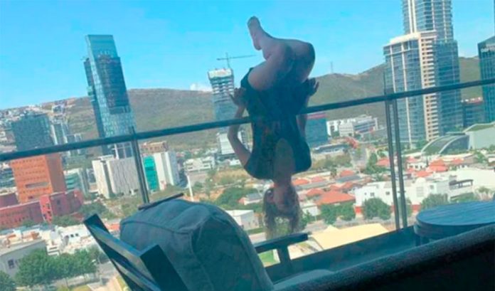 Terrazas practices yoga on her balcony.