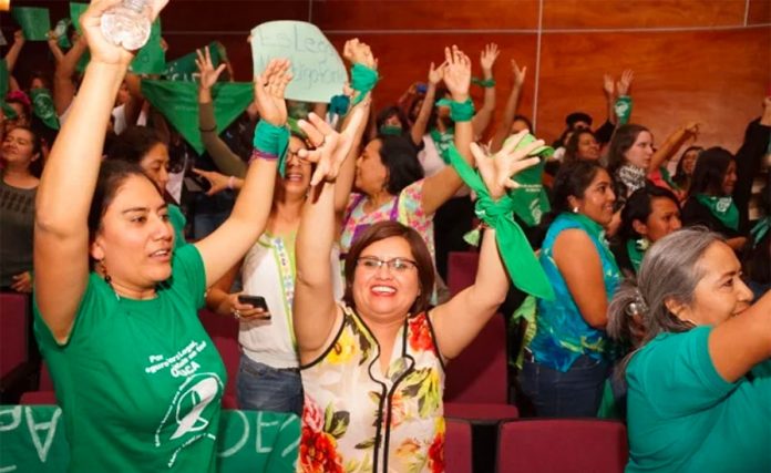 Supporters of abortion law cheer yesterday in Oaxaca.