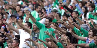 Soccer fans yell out the popular 'Eh puto' chant.