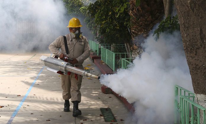 Spraying against dengue-carrying mosquitoes.