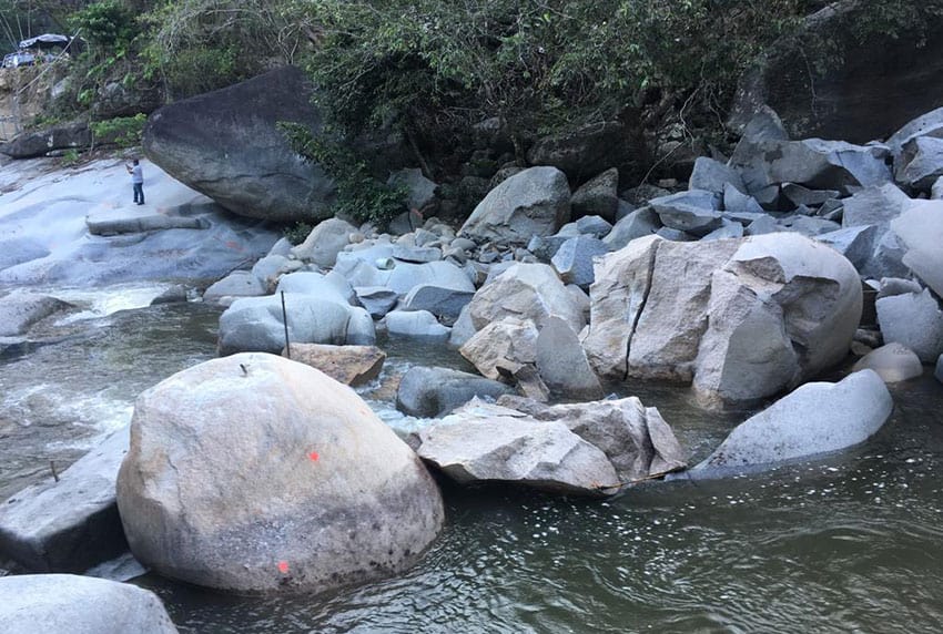 Piles of dynamited rubble were found in July at the proposed Los Horcones dam site where water-sculpted granite boulders had previously stood. 