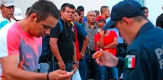 Federal Police arrest Iguala municipal police in 2014.