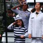 A future marine salutes during yesterday's Independence parade in Mexico City.