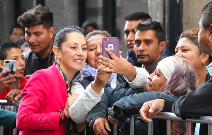 The mayor poses for selfies with fans yesterday in Mexico City.