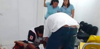 Paramedic treats victim of knife attack.