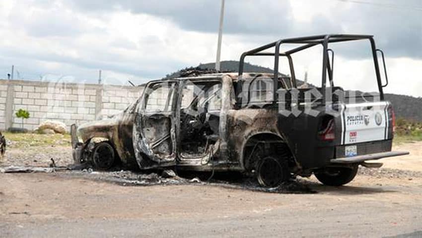 The hostage takers burned a patrol vehicle to press for the release of jailed suspects.