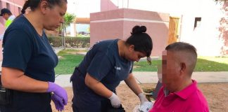 Paramedics treat the witness to an alleged massacre in Nuevo Laredo before transferring him to hospital.