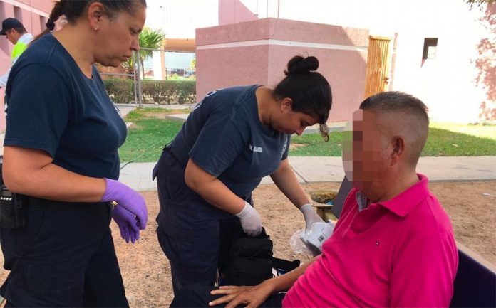 Paramedics treat the witness to an alleged massacre in Nuevo Laredo before transferring him to hospital.