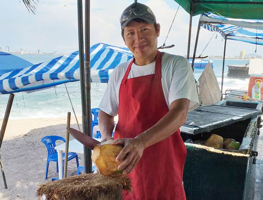 cutting coconuts