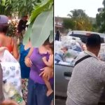 Presumed gang members hand out aid to storm victims in Jalisco.