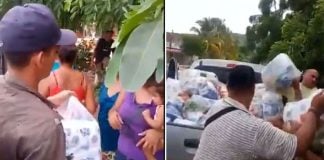 Presumed gang members hand out aid to storm victims in Jalisco.