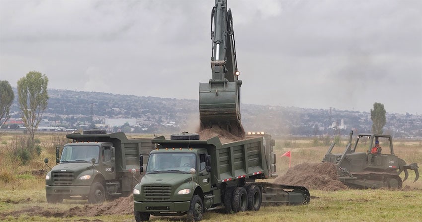 Military equipment at work on new airport site.