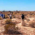 Searchers at the site where the bodies were found.