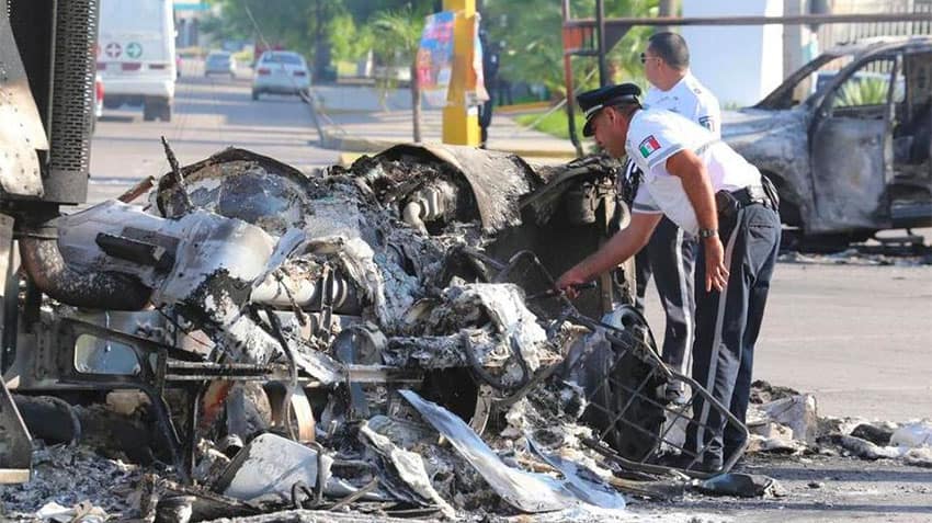 The wreckage of a burned-out vehicle after the violence in Culiacán.