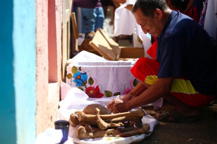 Cleaning up the family bones in Pomuch, Campeche.