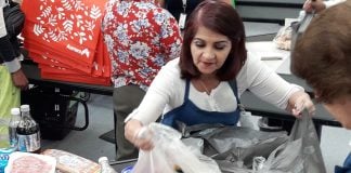 María Zarate bags groceries at a Mexico City supermarket.
