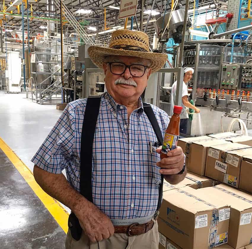 Roberto López in his salsa factory.