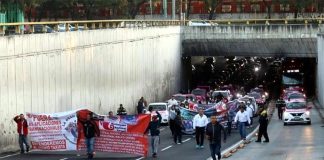 Taxi drivers march in Mexico City on Monday.