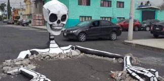 A skeleton surfaces in a street in Tláhuac, Mexico City.