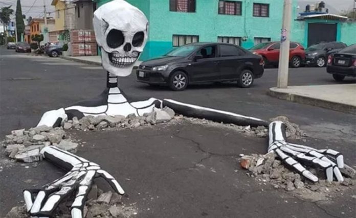 A skeleton surfaces in a street in Tláhuac, Mexico City.