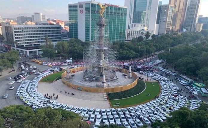 Protesting taxis surround the Ángel de Independencia in Mexico City.