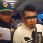 A police officer takes masturbation suspect into custody.