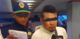 A police officer takes masturbation suspect into custody.